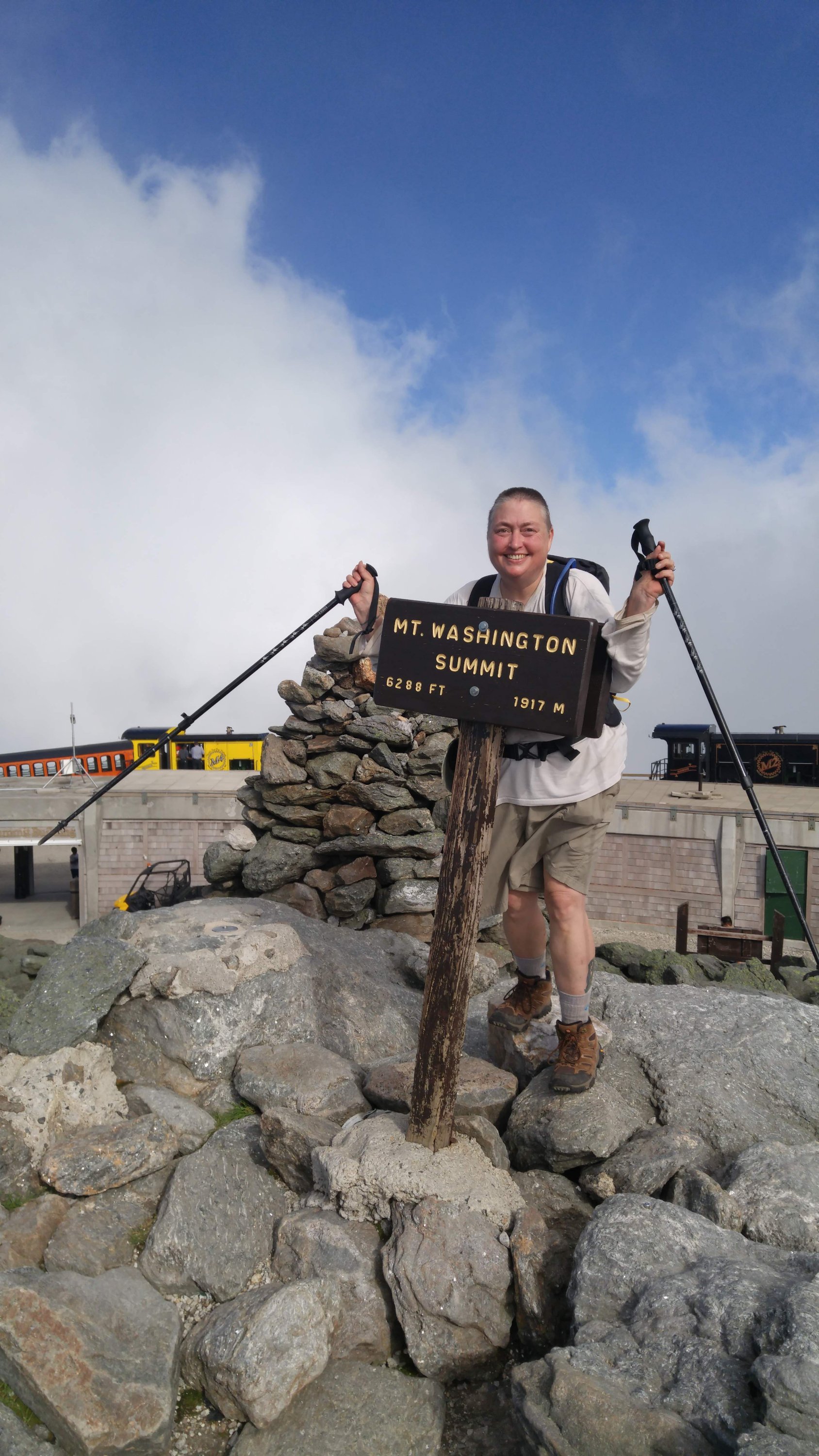 Carmel is smiling, overjoyed from reaching the summit of Mount Washington