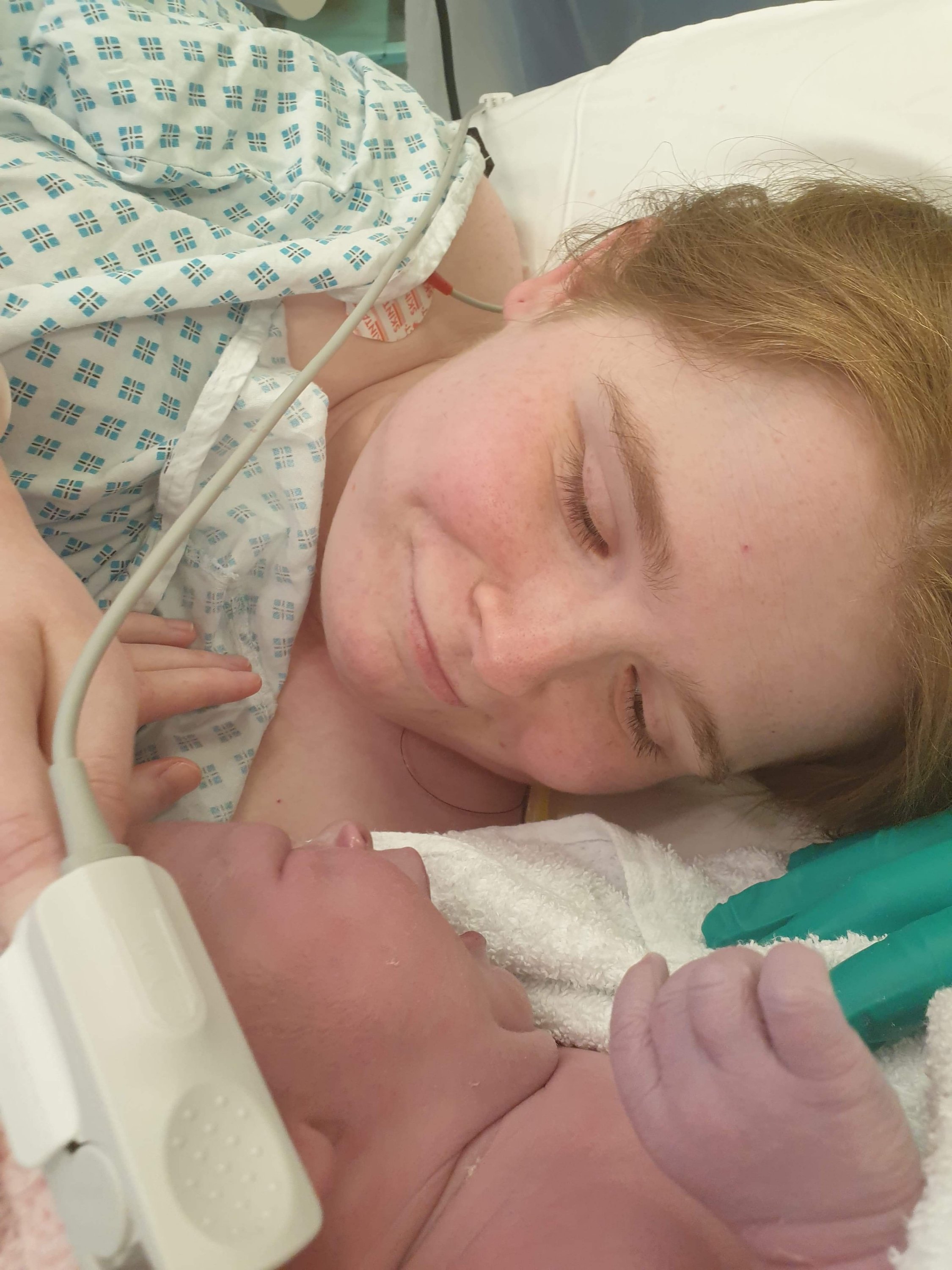 Photo of Ami smiling as she meets her Little Avenger for the first time