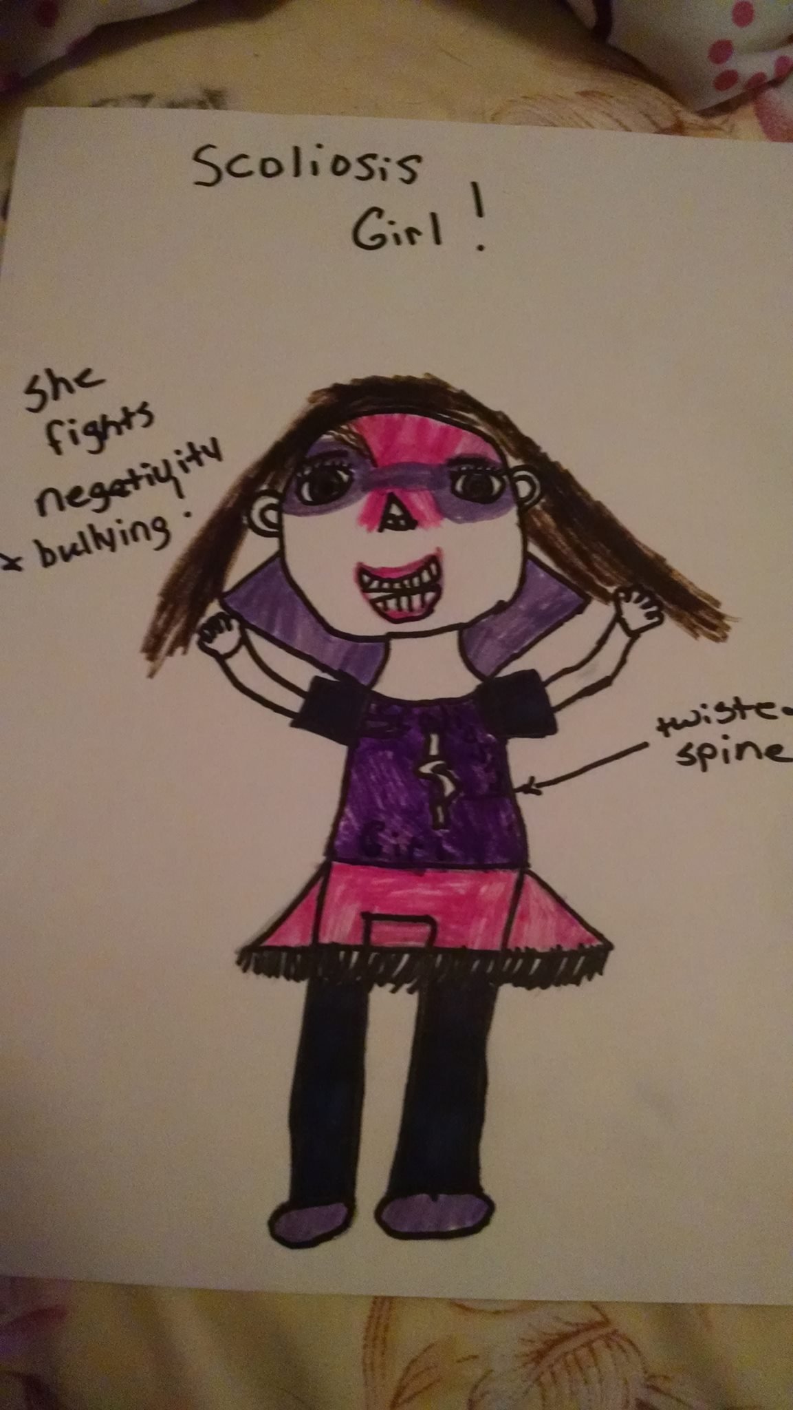 Jamie's drawing of Scoliosis Girl, who is characterized by fighting negativity and bullying, is wearing a purple and pink outfit with a twisted spine.