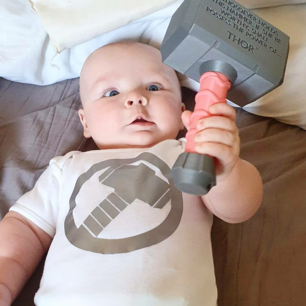 Daisy is holding her Thor rattle